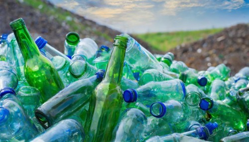 Used glass in a pile, only empty bottles, in a recycling plant, AI generated, AI generated