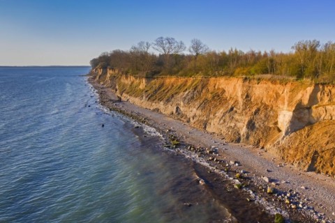 Aerial view over beach and Brodtener Ufer, Brodten Steilufer, cliff in the Bay of Luebeck along the