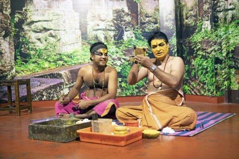 Kathakali performers or mime artists, 38 and 60 years old, make up their faces, Kochi Kathakali