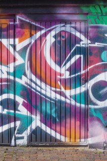 Graffiti, colourfully painted door on a garage, Bremen, Germany, Europe