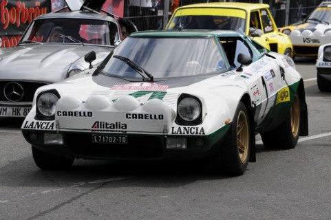 A white and green Lancia Stratos with the number 419 in rally livery at a race, SOLITUDE REVIVAL