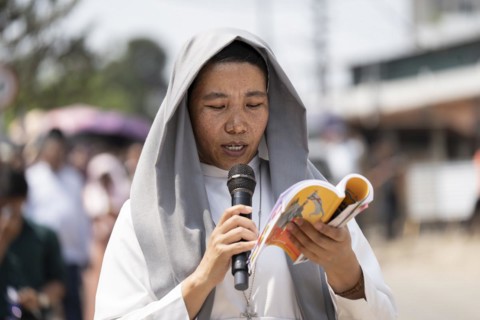 Christian devotees takes part in a perform to re-enactment of the crucifixion of Jesus Christ