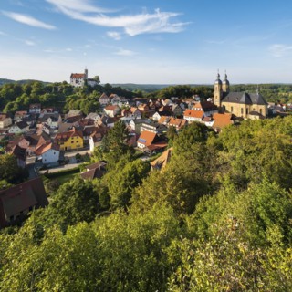 View of Goessweinstein with castle, pilgrimage church and half-timbered houses, Franconian