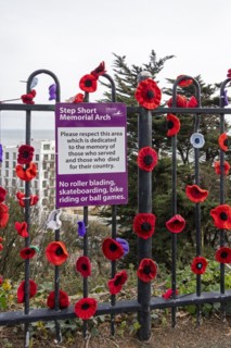 Sign, crocheted flowers, Road of Remembrance, Folkestone, Kent, Great Britain
