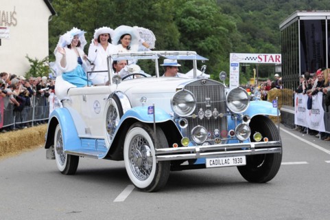 Cadillac Imperial Phaeton, built in 1930, A white Cadillac convertible with costumed woman drives