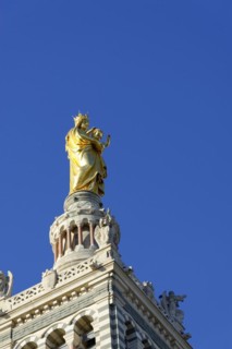 Church of Notre-Dame de la Garde, Marseille, Golden religious statue on a cathedral in front of a
