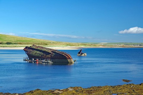 Parts of sunken ships sticking out of the water, Churchill Barriers, 2nd World War, Orkney Islands,