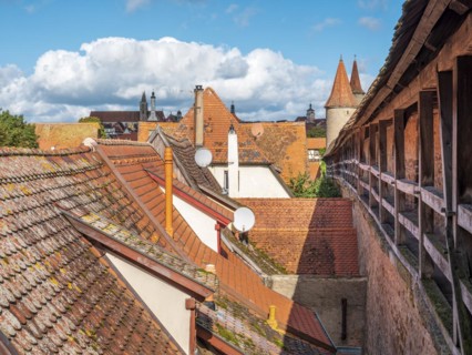 View from the battlements of the town wall to the houses and towers of the historic old town,