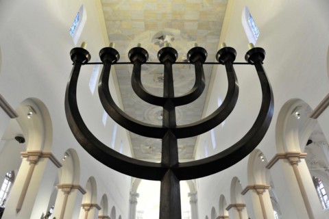 St Kilian's Cathedral, St Kilian's Cathedral, Wuerzburg, Black menorah in front of an altar in a