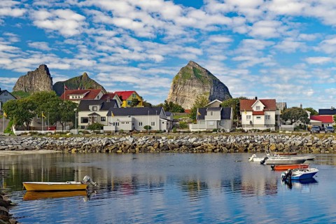 Small harbour and high mountains on the island of Traena, Lovunden, Helgeland coast, Norway, Europe