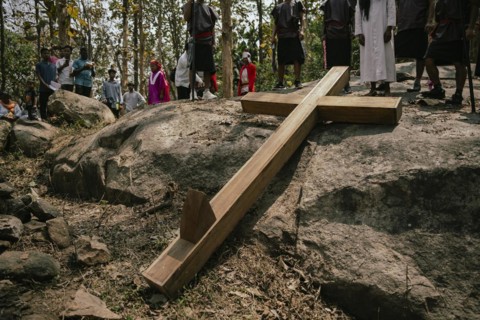 Christian devotees takes part in a perform to re-enactment of the crucifixion of Jesus Christ