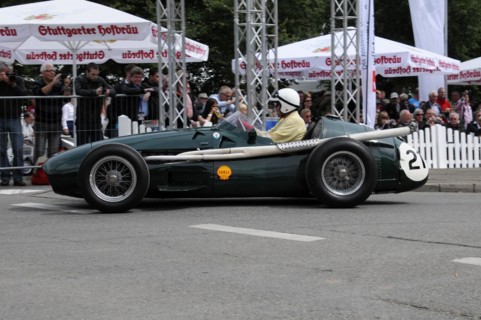 A green vintage racing car with the number 20 drives past spectators, SOLITUDE REVIVAL 2011,