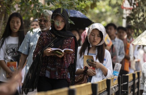 Christian devotees takes part in a perform to re-enactment of the crucifixion of Jesus Christ