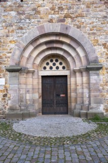 Slogan All and in all Christ above a door of St Mary's Cathedral, Havelberg, Saxony-Anhalt,