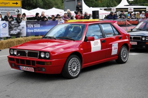 A red Audi rally car with starting number 184 drives on a race track, SOLITUDE REVIVAL 2011,