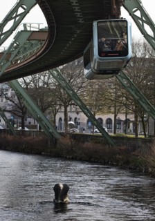 Suspension railway and sculpture by Bernd Bergkemper in the river Wupper commemorating the jump of