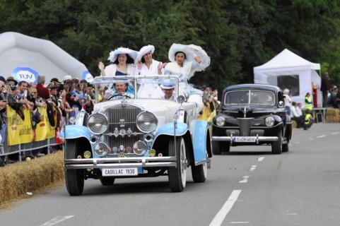 Cadillac Imperial Phaeton, built in 1930, A white Cadillac parade car with woman in historical
