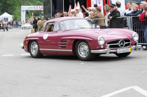 Red Mercedes vintage coupe at a racing event with an audience, SOLITUDE REVIVAL 2011, Stuttgart,