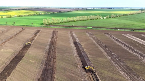 Excavators begin preparations for the construction site access road on the L 50 at the future Intel