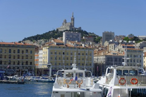 The old harbour, Vieux Port, behind the basilica Notre-Dame de la Garde, view of a harbour with