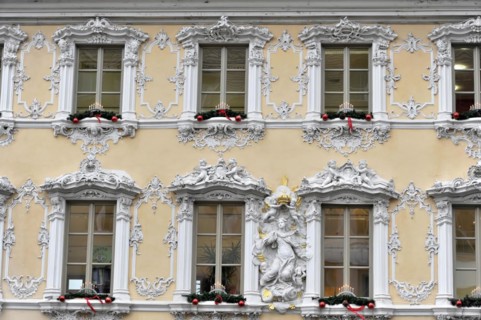 Facade view of the Falkenhaus with stucco facade in rococo style in the centre of Wuerzburg, rococo
