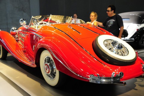 A bright red convertible vintage car at an exhibition, Mercedes-Benz Museum, Stuttgart,