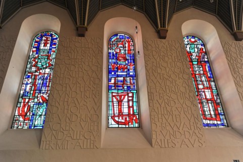 Speyer Cathedral, Colourful stained glass windows next to a wall with relief-like lettering, Speyer