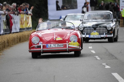 A red Porsche 356 at a classic car rally surrounded by spectators, SOLITUDE REVIVAL 2011,