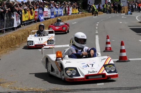 Racers concentrate on the race in white soapboxes in front of a crowd, SOLITUDE REVIVAL 2011,