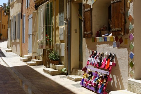 The bay of Port Miou in Cassis, Old street with traditional colourful houses, plants and front