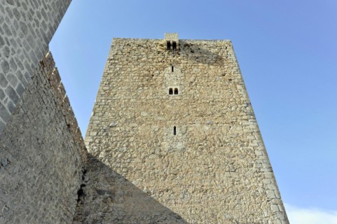 Jaen, Castillo de Santa Catalina on Jaen, View of an old stone defence defence tower in front of a