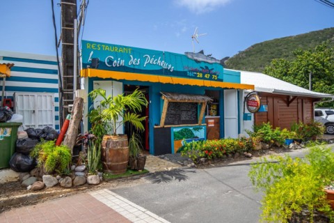 Deshaies, historic Caribbean wooden building of a street in Guadeloupe, Caribbean, French Antilles