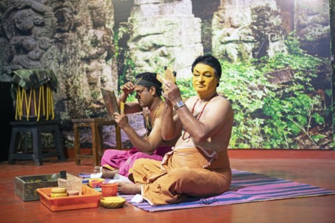 Kathakali performers or mime artists, 38 and 60 years old, make up their faces, Kochi Kathakali