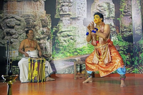 Kathakali performer or mime, 60 years old, and drummer on stage at the Kochi Kathakali Centre,