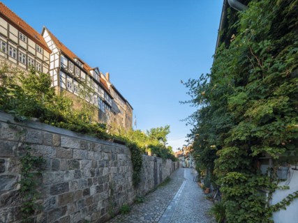 Narrow alley with half-timbered houses and cobblestones on the Schlossberg in the historic old