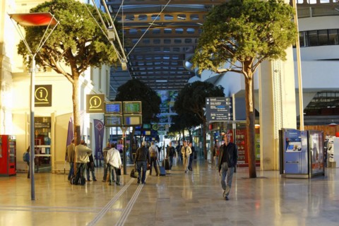 Marseille-Saint-Charles railway station, Marseille, travellers in an illuminated station concourse