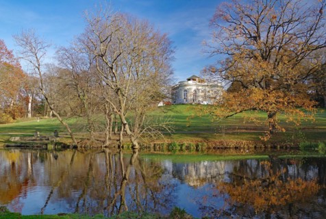 Richmond Castle reflected in the calm waters of the Oker, autumn, Braunschweig, Lower Saxony,