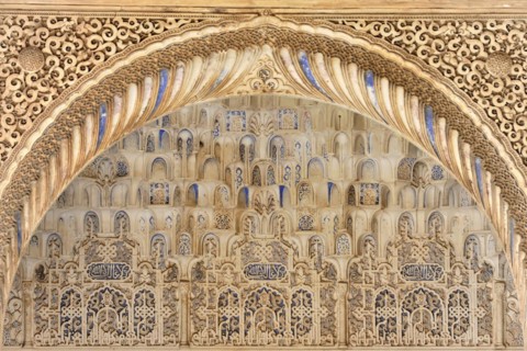 Artistic stone carvings, Alhambra, Granada, A detailed Islamic stone carving with arches and