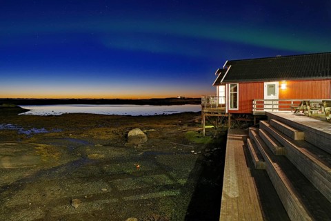 Red building with balcony by the water, Northern lights (aurora borealis), Rorbuer, holiday,
