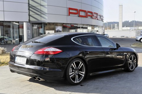 Side view of a black Porsche Panamera outside a car dealership, Schwaebisch Gmuend,