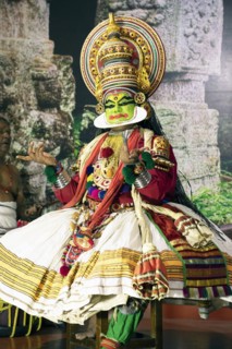 Kathakali performer or mime, 38 years old, on stage at the Kochi Kathakali Centre, Kochi, Kerala,