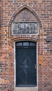Relief with crucified Christ above a door of the parish church of St Laurentius, Havelberg,