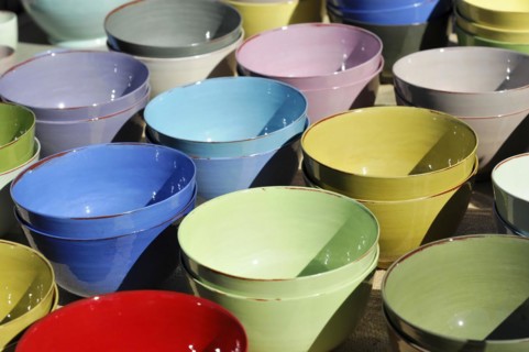 Pottery bowls, pots, colourful stacked clay bowls at an outdoor market, Marseille, Departement