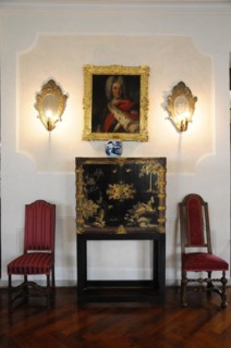 Langenburg Castle, Classic interior with portrait painting and candlesticks on the wall and two red