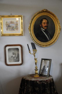 Langenburg Castle, wall with paintings, photos and candlesticks in historical style, Langenburg