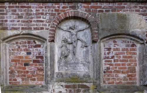 Stone relief of the crucified Christ at St Mary's Cathedral, Havelberg, Saxony-Anhalt, Germany,