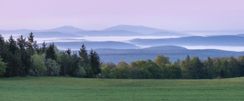 Panorama, view over endless chains of hills and forests at Gebaberg at dawn, fog in the valleys,