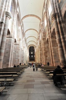 Speyer Cathedral, interior view of a church with pews and columns, soft light falls through the