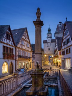 Roedergasse with Roederbrunnen, Markusturm and Roederbogen at dawn, Rothenburg ob der Tauber,