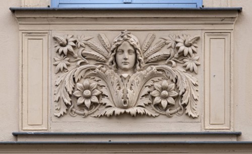 Relief with a woman's face on a house wall, Havelberg, Saxony-Anhalt, Germany, Europe